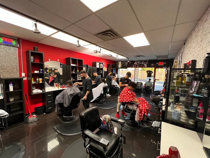 Inside Clean Cut Barber Shop — barbers at work